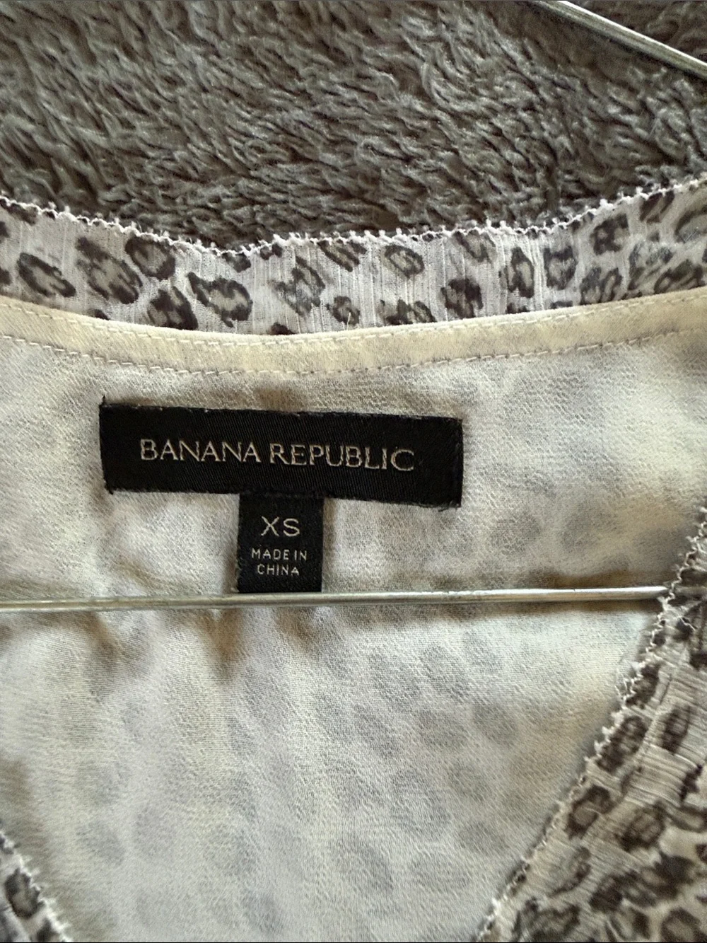Two Banana Republic sleeveless blouses.